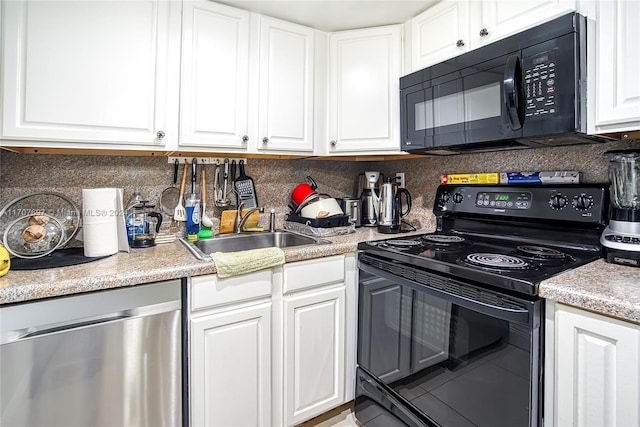 kitchen featuring black appliances, a sink, and white cabinets