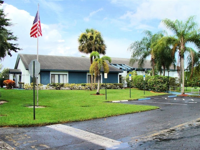 ranch-style house with a front lawn