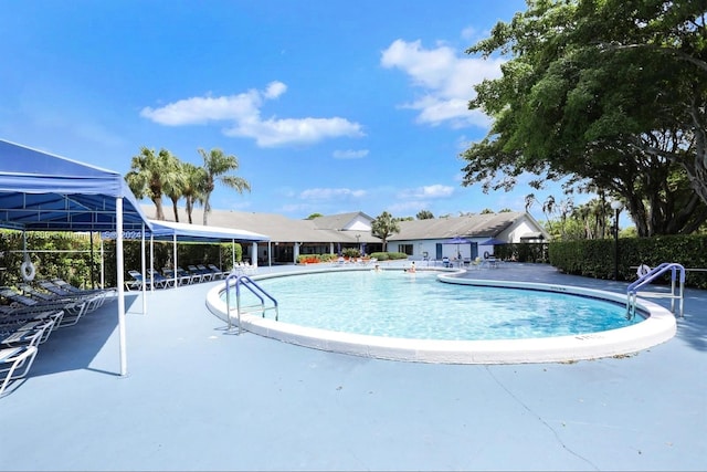 view of swimming pool with a patio