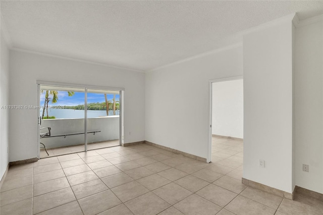 empty room featuring light tile patterned floors, a textured ceiling, a water view, and crown molding