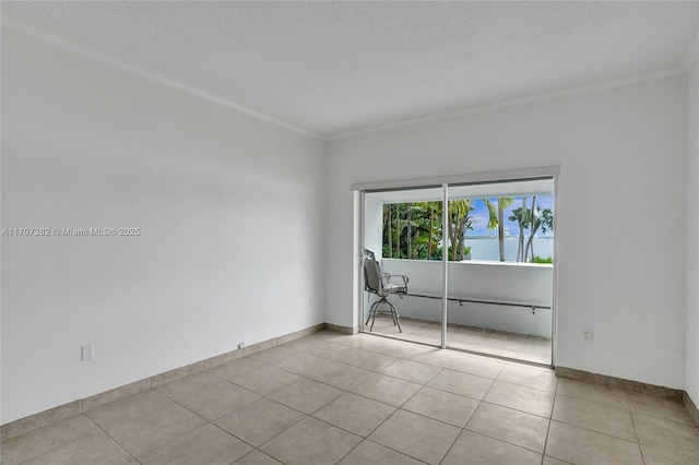 500 Bayview Dr Unit 118, Sunny Isles Beach, FL 33160 - unfurnished room featuring crown molding, light tile patterned flooring, a textured ceiling, and baseboards