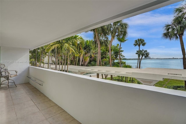 balcony featuring a water view