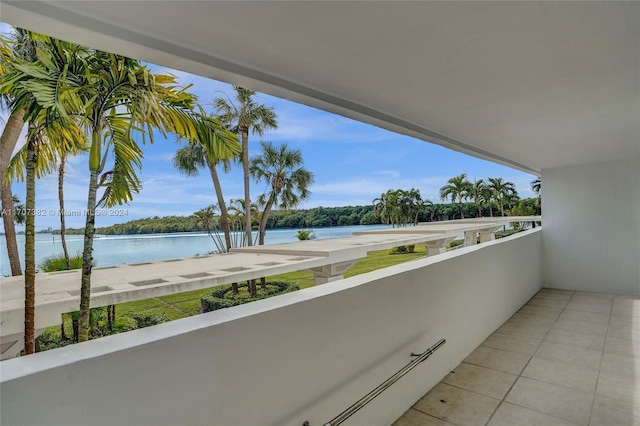 balcony featuring a water view