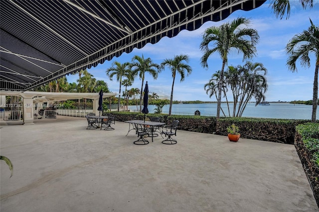 view of patio with a water view