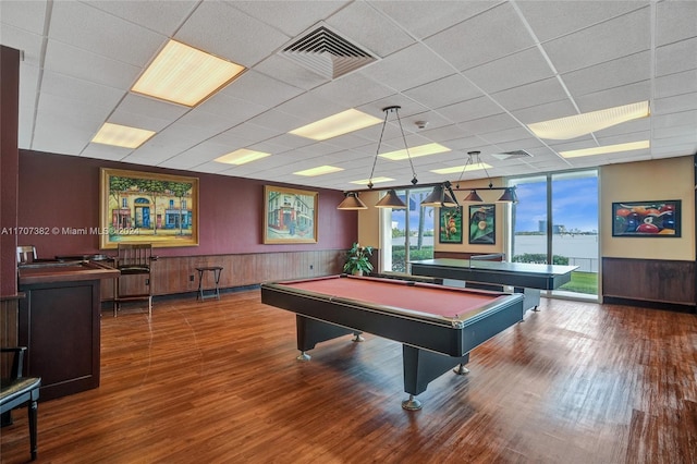 recreation room featuring hardwood / wood-style flooring, a drop ceiling, and pool table