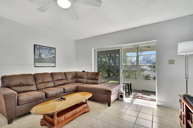 tiled living room featuring ceiling fan and a textured ceiling