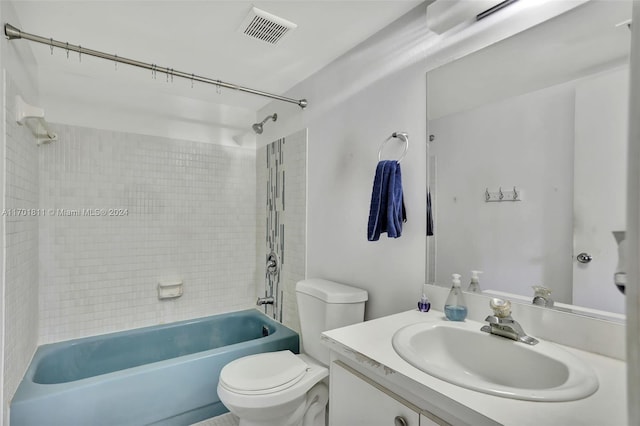 full bathroom featuring vanity, toilet, and tiled shower / bath