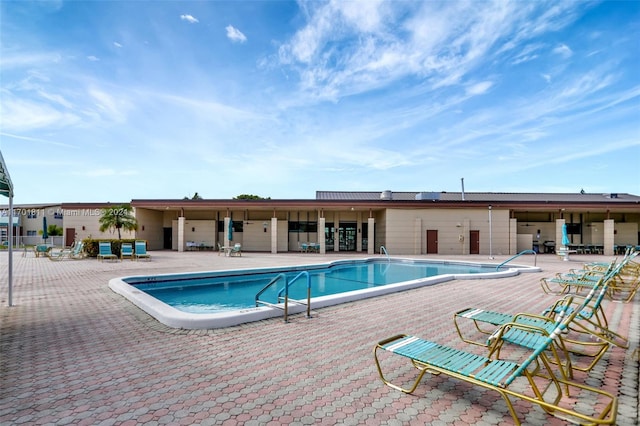 view of swimming pool with a patio area