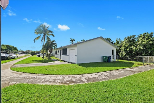 view of property exterior with a lawn