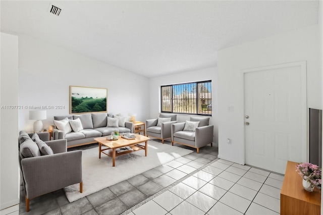 tiled living room with lofted ceiling