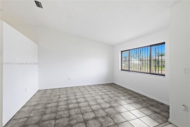 empty room with a textured ceiling