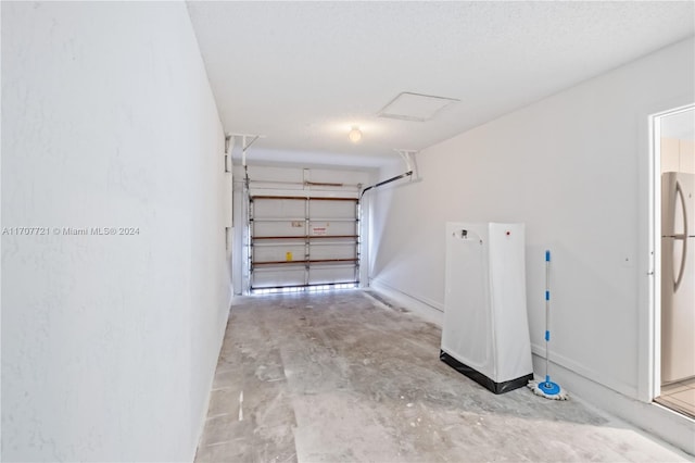 garage featuring stainless steel fridge