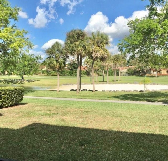 view of home's community featuring a yard