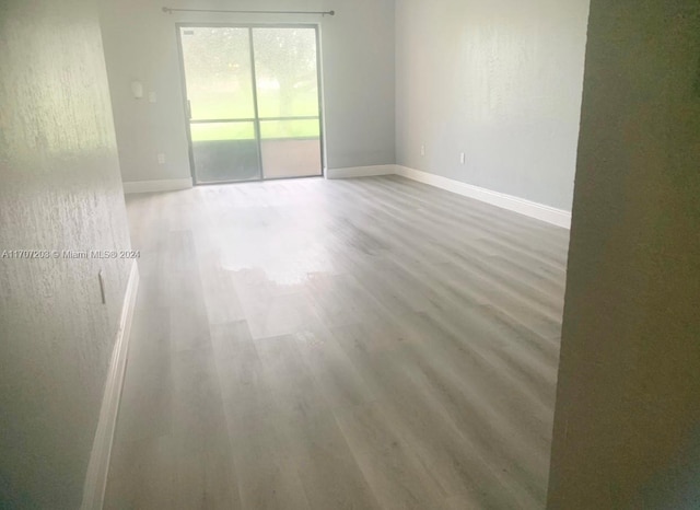 spare room featuring hardwood / wood-style flooring