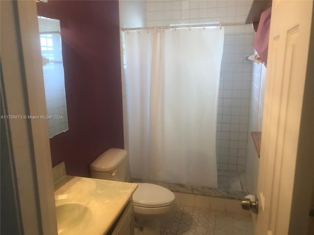 bathroom featuring toilet, vanity, tile patterned floors, and walk in shower