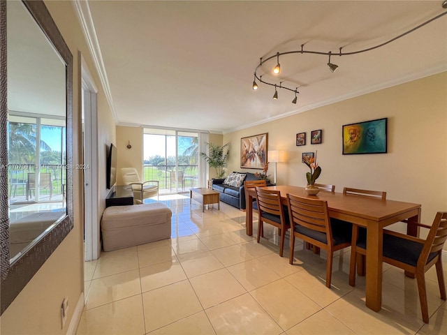 tiled dining space featuring crown molding