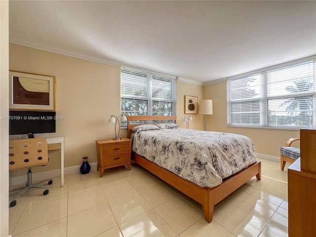 bedroom with light tile patterned floors and crown molding