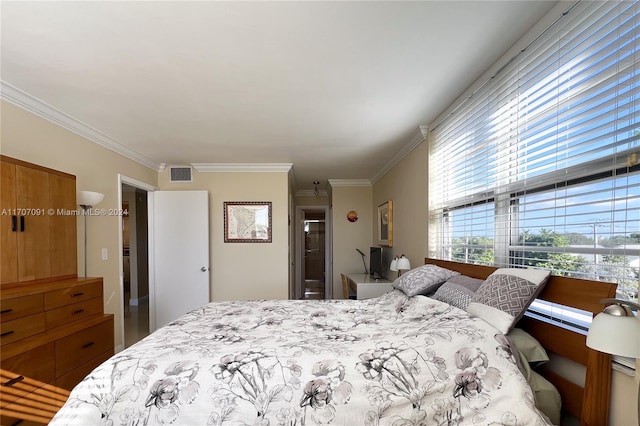 bedroom with crown molding