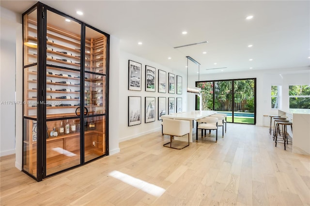 interior space featuring a chandelier and light wood-type flooring