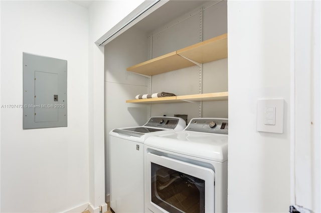 washroom with electric panel and independent washer and dryer