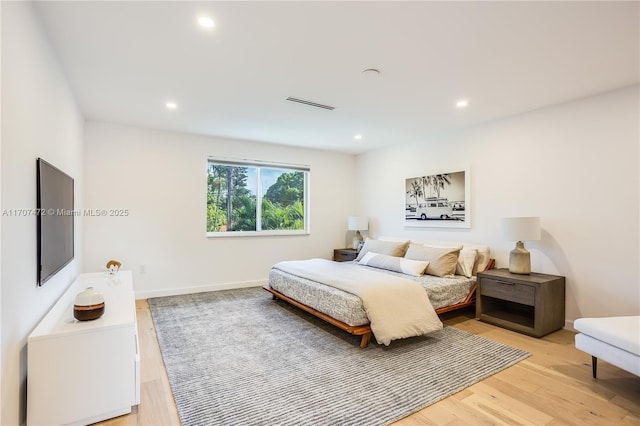 bedroom with light wood-type flooring