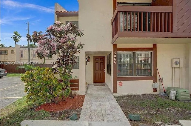 entrance to property with a balcony