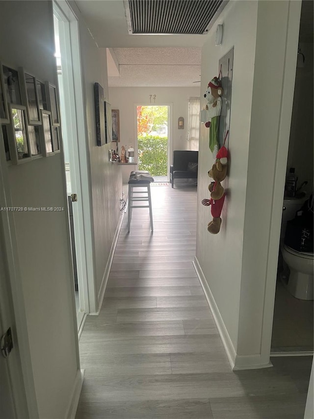 hall featuring light hardwood / wood-style flooring