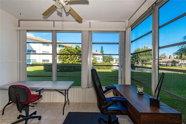 sunroom featuring ceiling fan