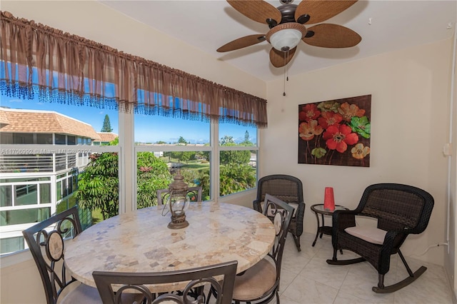 interior space with ceiling fan