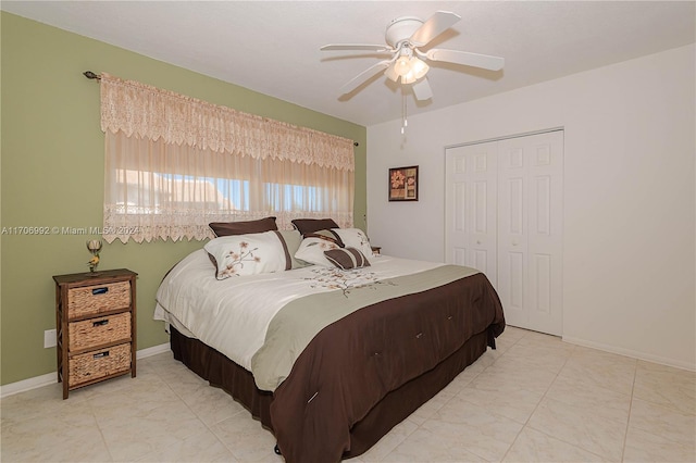 bedroom featuring ceiling fan and a closet