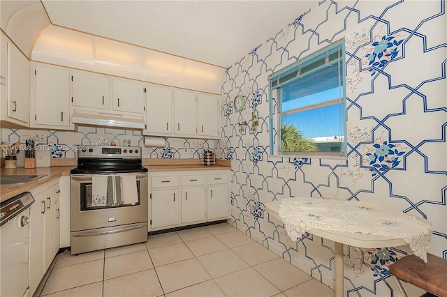 kitchen with a textured ceiling, stainless steel electric range oven, dishwasher, white cabinetry, and light tile patterned flooring