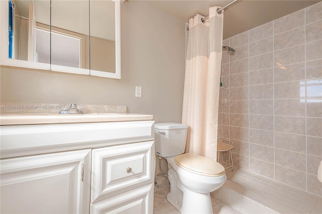 bathroom with toilet, a shower with curtain, vanity, and tile patterned floors