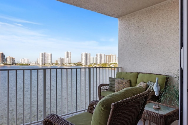 balcony featuring a water view