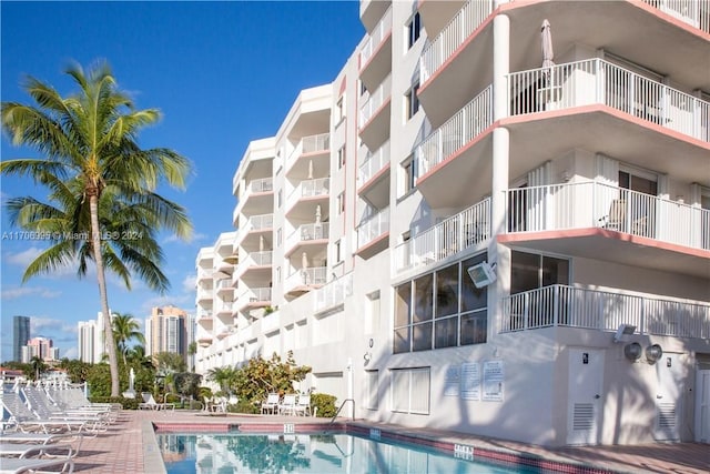 view of property featuring a community pool