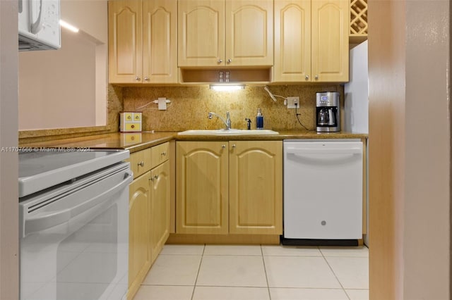 kitchen featuring decorative backsplash, white appliances, sink, light brown cabinets, and light tile patterned flooring