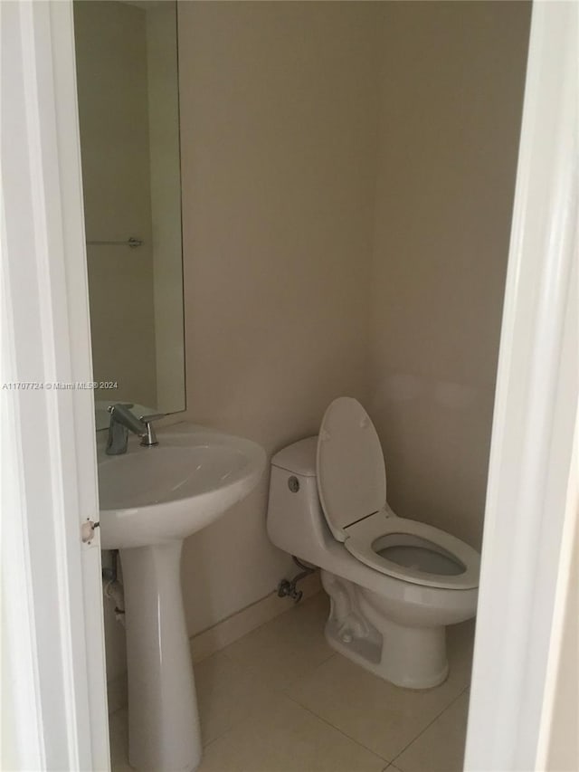 bathroom featuring toilet and tile patterned floors