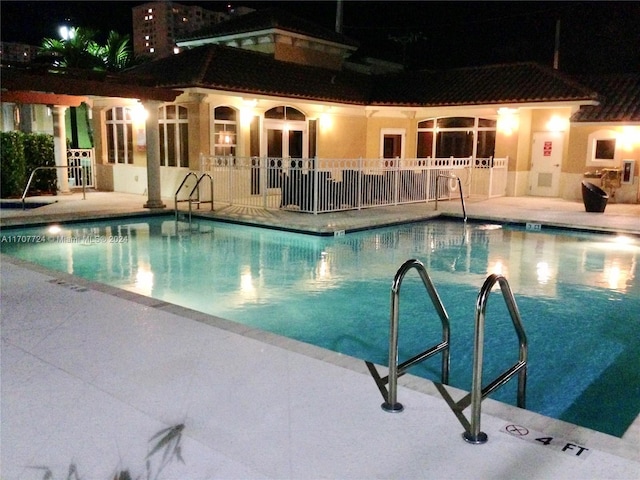 view of swimming pool with a patio