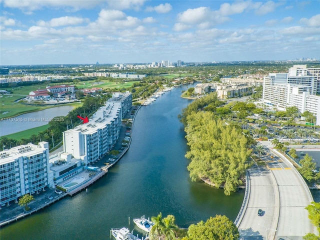 drone / aerial view featuring a water view and a city view