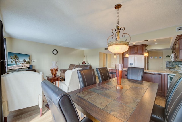 dining area with light hardwood / wood-style flooring