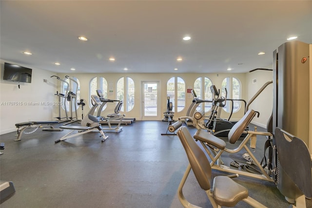 exercise room featuring baseboards and recessed lighting