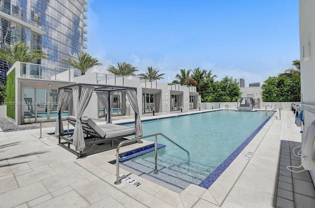 view of swimming pool with a patio area