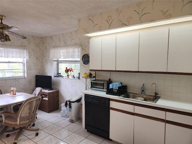 kitchen with sink, a textured ceiling, dishwasher, ceiling fan, and white cabinets