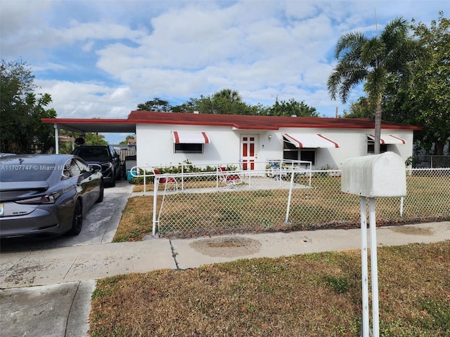 317 NW 3rd St, Deerfield Beach, FL 33441 - view of front of house featuring a front lawn and a carport