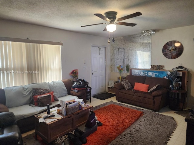 317 NW 3rd St, Deerfield Beach, FL 33441 - living room featuring ceiling fan and a textured ceiling