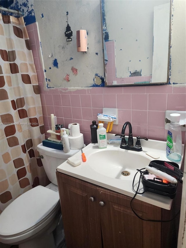 317 NW 3rd St, Deerfield Beach, FL 33441 - bathroom with a shower with shower curtain, vanity, toilet, and tile walls