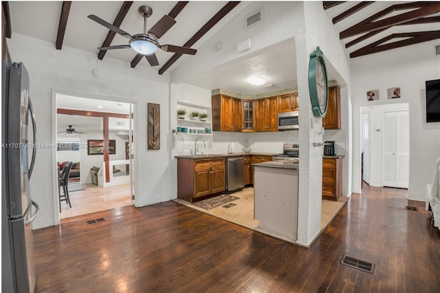 kitchen with decorative backsplash, lofted ceiling with beams, stainless steel appliances, and dark hardwood / wood-style floors