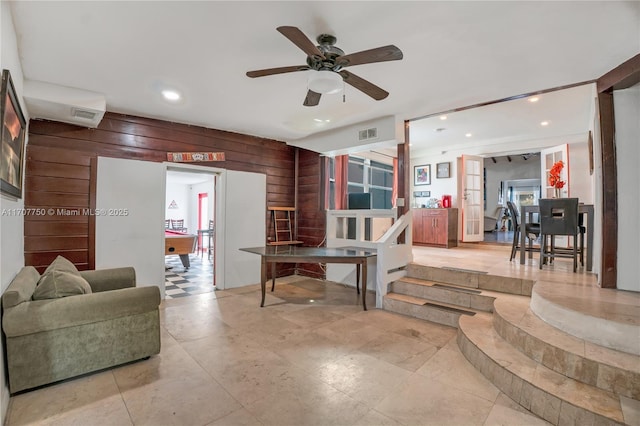 living room featuring french doors, ceiling fan, wooden walls, and billiards