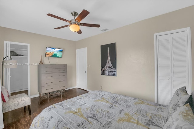 bedroom with ceiling fan and dark hardwood / wood-style flooring