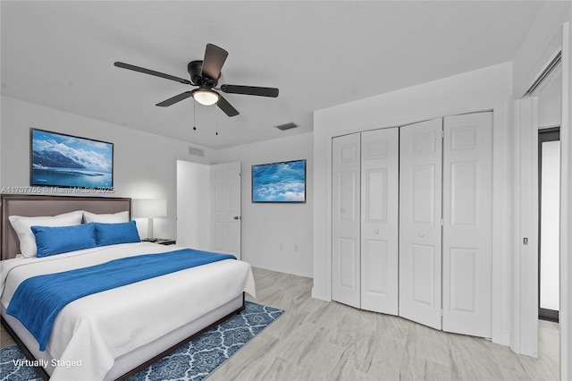 bedroom with ceiling fan and light hardwood / wood-style flooring