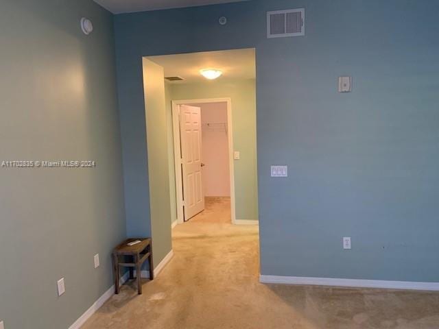 hallway with light carpet